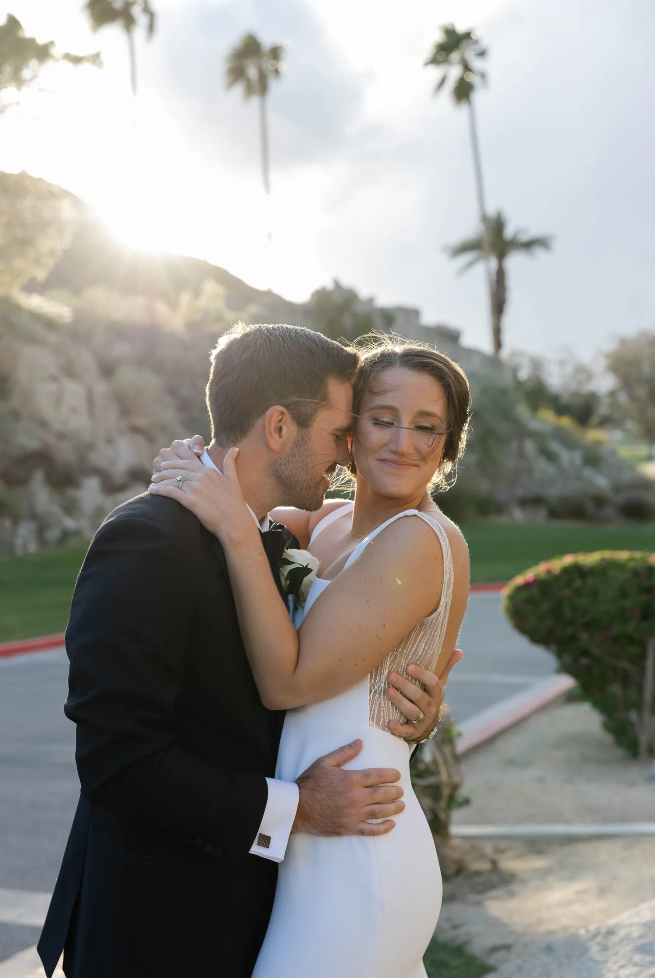 Bride and groom embracing at a Southern California wedding