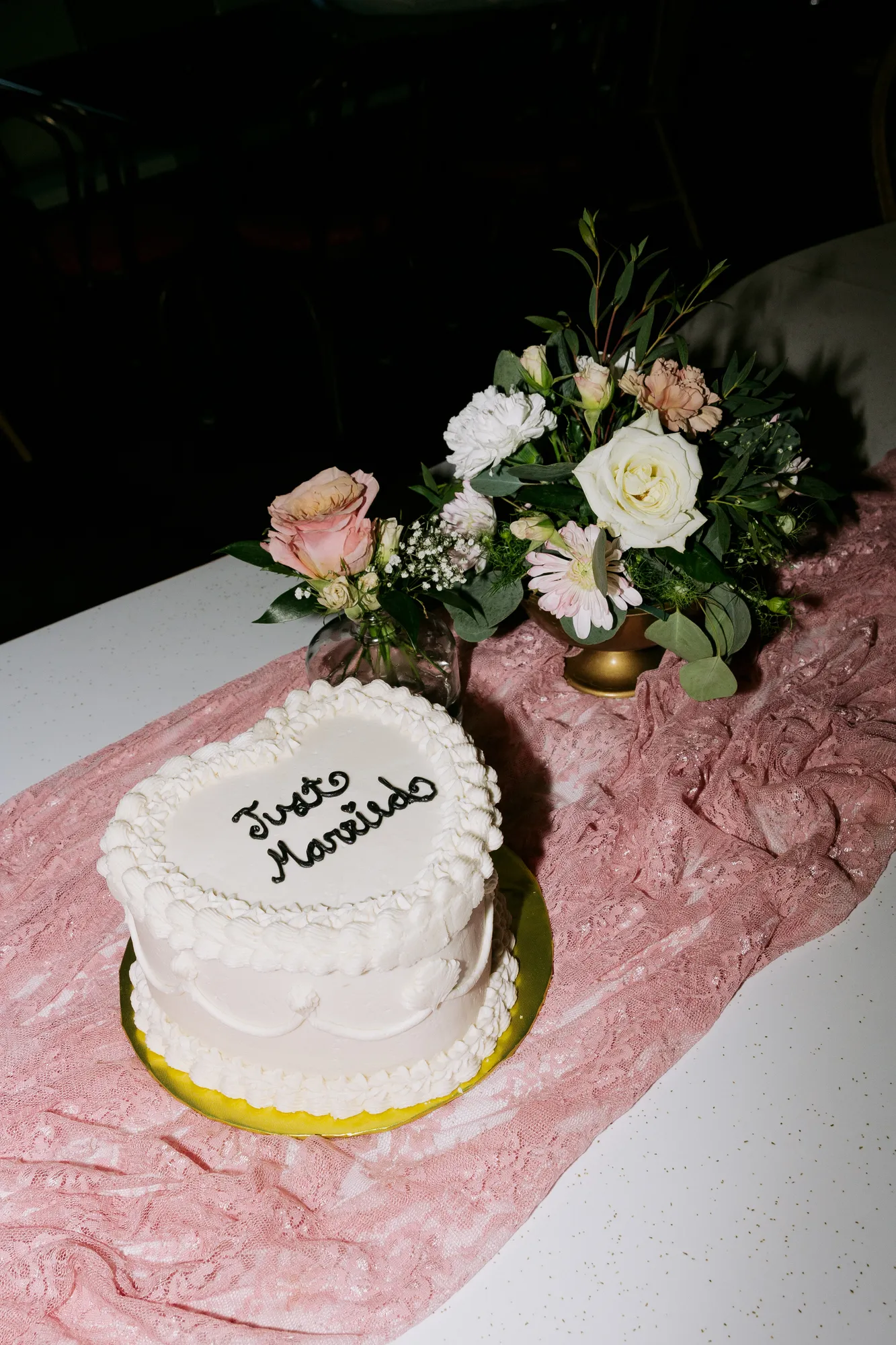 Pink wedding cake and bridal details